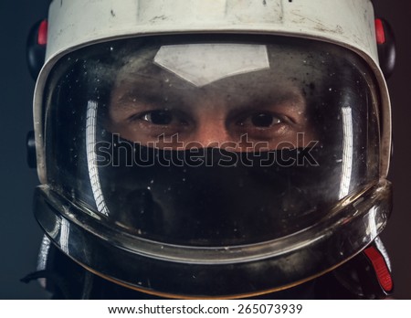 Portrait of a man in firefighter helmet.