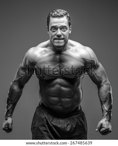 Black and white portrait of muscular guy.