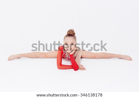 Little Girl In Red Dress Doing Gymnastic Split. Isolated On White ...