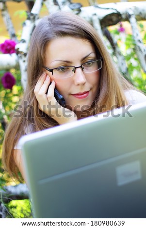 Young woman looking at laptop