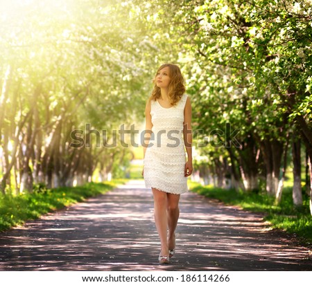 Girl walking in the park. spring
