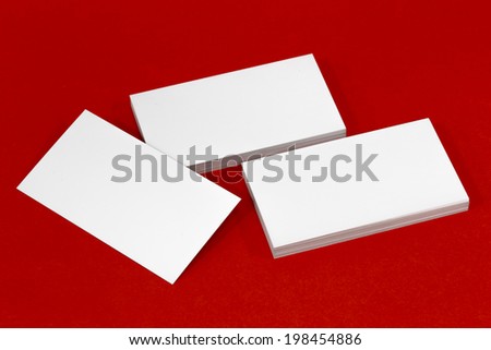 Business card template mockup for branding identity or contact information drawing. Ready to print modern abstract design or hipster logo. Isolated on red paper background.