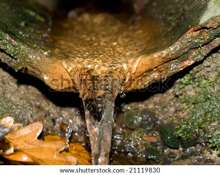 Broken Pipe Underground with Running Water Pouring Out