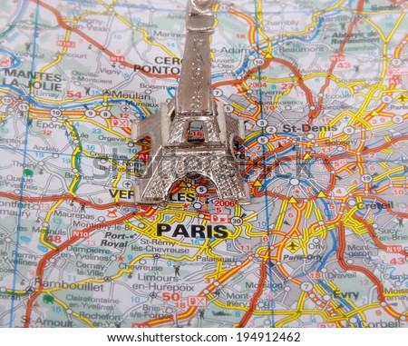 Eiffel Tower on a map of Paris, short focus