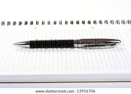 Notepad with pen isolated
