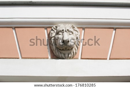 Decorative element facade bas-relief with a lion\'s head