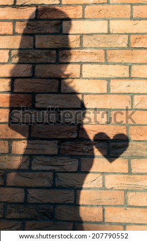 mage of pregnant woman shadow and heart