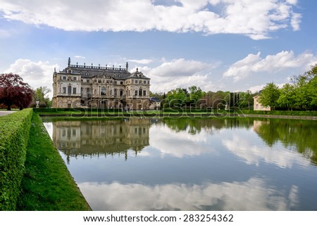 DRESDEN, GERMANY - APRIL 26: Baroque palace reflected in waters of Palaisteich in Grosser Garten park in Dresden, Germany. The image was taken on April 26, 2015.