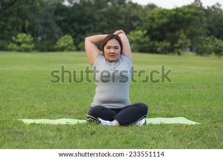 Obese woman cooling down after finished her workout.