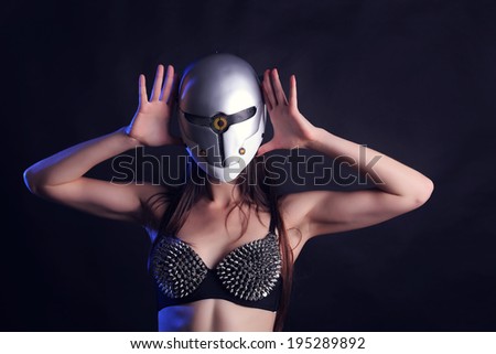 Sexy female go go dancer in the mask