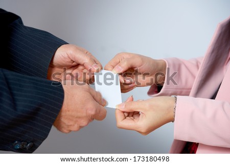 Asian businessman exchange a business card with a business woman