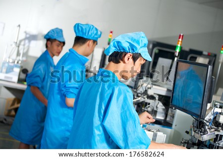 Chinese worker on led factory check product quality