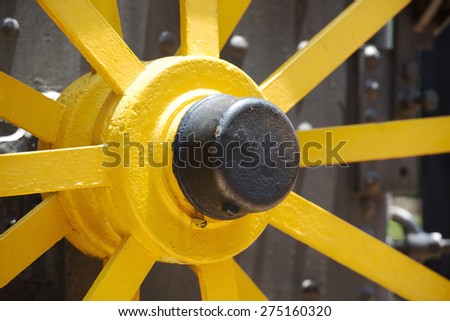 Last century gold mine equipment detail, yellow wheel