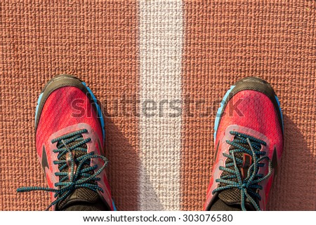 Running shoes on a run track.