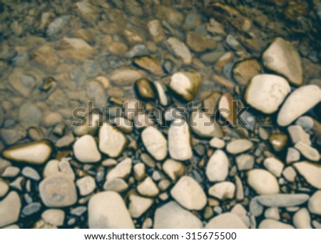 De focused/Blurred image of different sizes of rocks. Rock background.