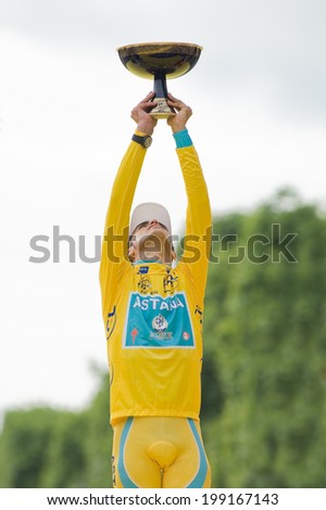 PARIS, FRANCE - JULY 26, 2010 : Alberto Contador on the podium of  the Champs Elysees after wining the Tour de France 2010