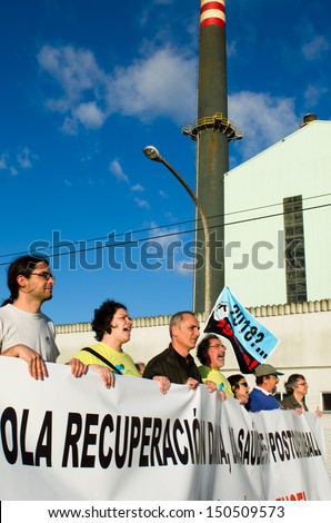 PONTEVEDRA, SPAIN - JUNE 6: Detail of the demonstration ecologist for the closure of the pulp mill in the Ria of Pontevedra in Galicia, June 6, 2013 in Pontevedra, Spain.
