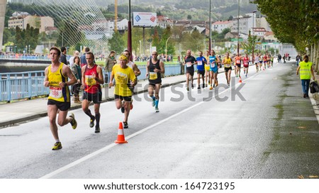PONTEVEDRA - OCTOBER 20: Detail of the participants in the XVII Half Marathon held on the street circuit in the village of Pontevedra, on October 20, 2013.