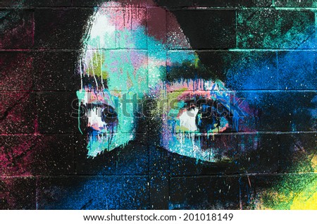 BARCELONA, SPAIN - APRIL 11, 2014: An impressive graffiti of a woman\'s face on a wall in the neighborhood of Clot in Barcelona.