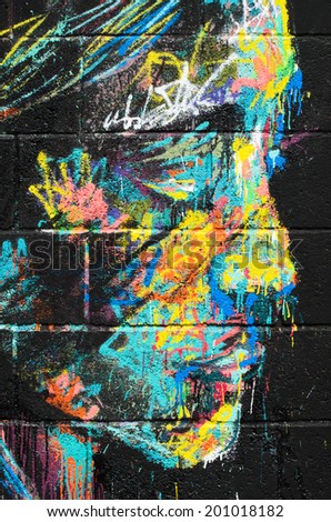 BARCELONA, SPAIN - APRIL 11, 2014: An impressive graffiti of a woman\'s face on a wall in the neighborhood of Clot in Barcelona.