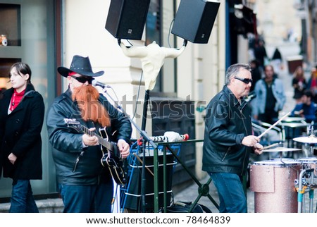 BAYONNE, FRANCE - MARCH 12: A rock band  ZZ Top imitating, playing in the street during carnivalcelebrations in Bayonne, March 12, 2011, Bayonne, France.