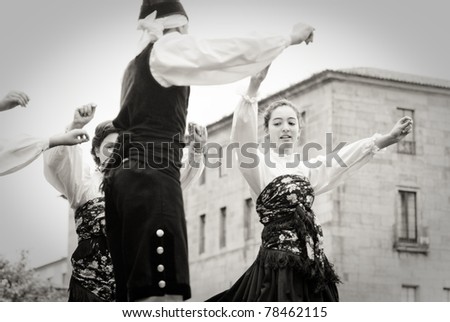 PONTEVEDRA, SPAIN - MAY 1: Folk dance group from Galicia dance during the celebration of the May Festival in Pontevedra, May 1, 2011, Pontevedra, Spain.