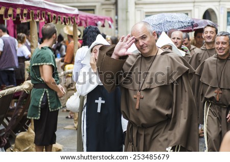PONTEVEDRA, SPAIN - SEPTEMBER 6, 2014: A group of men dressed in monk's robes, in medieval festival held each year in the historical district of the city.