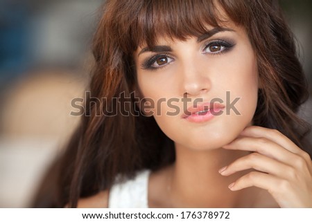 Beautiful young brunette woman face close up. portrait or pretty happy smiling girl in cafe. Woman with long brown hair outdoors. young skin, perfect face, skincare, lifestyle woman portrait. Series