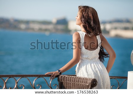 Beautiful young Woman at sea Lifestyle Portrait summer vacation, pretty young girl resting at luxury villa near beach. Series