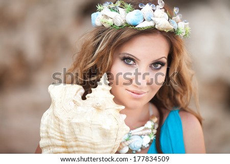 Fantasy makeup woman with shell wreath, mermaid girl with seashell. Fairy sea nymph.  Ocean Goddess.