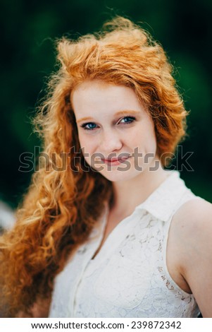 Attractive Young Female Redhead, slight smile, vertical