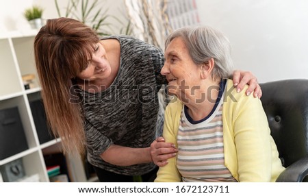 Similar – Image, Stock Photo Woman visiting her grandmother in isolation during a coronavirus pandemic
