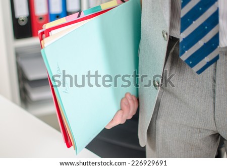 Businessman holding files, closeup