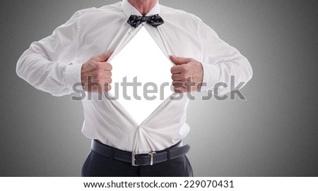 Businessman showing his fighting spirit by opening his shirt