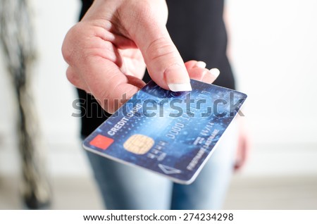 Woman hand showing credit card, closeup