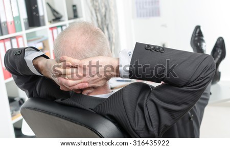 Relaxed businessman during a break at office