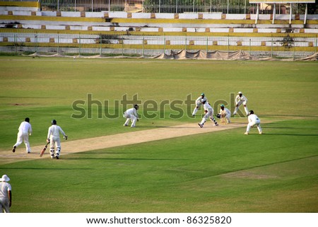 SIALKOT, PAKISTAN - OCTOBER 08: Danish Kaneria bowling during Quaid-e-Azam Trophy Cricket Match Played Between Sialkot and HBL Teams at Jinnah Cricket Stadium. October 08, 2011 in Sialkot, Pakistan