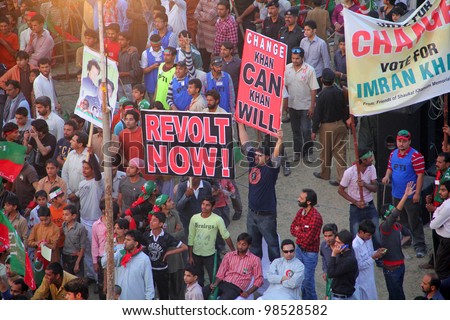 SIALKOT, PAKISTAN - MAR 23: Over hundred thousand people gather at Jinnah Cricket Stadium during a political rally of cricketer turned politician Imran Khan on March 23, 2012 in Sialkot, Pakistan