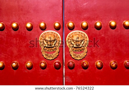 Iconic door with its protecting lions. The entrance of the Temple of Heaven, Beijing, China.