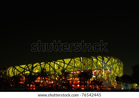 BEIJING, CHINA - APRIL 26:  The Beijing National Stadium( the Bird\'s Nest) lights up on April 26, 2011 in Beijing, China.As a landmark of modern China, which attracting million of tourists each year.