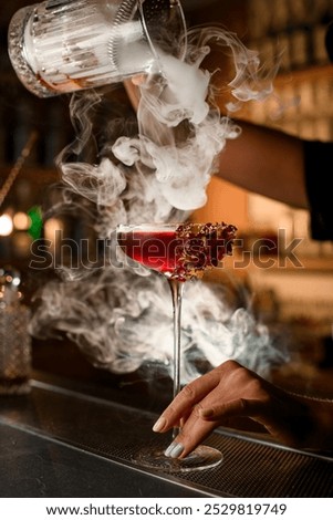 Similar – Image, Stock Photo Red alcohol cocktail with black olive and whiskey lemon cocktail