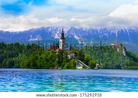View of Bled island and a church on it and castle cliff, main tourist attractions in Slovenia