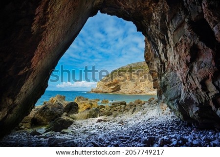 Similar – Image, Stock Photo Rough cave near sea during sunset