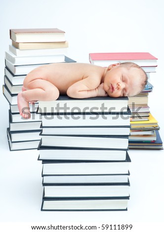 New born baby sleep on books in the library