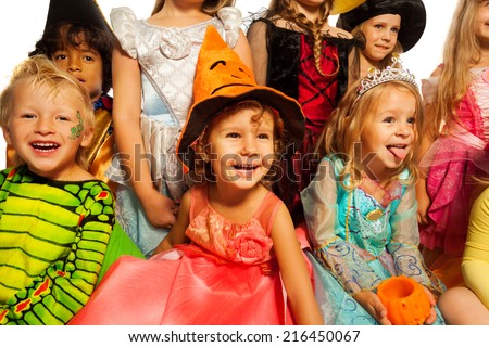 Many happy kids in Halloween costumes