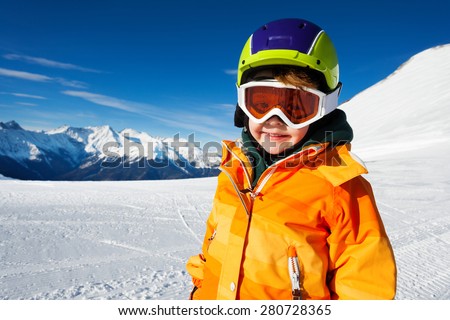 Close-up view of boy wearing ski mask on ski-track of Sochi ski resort Krasnaya polyana, Russia