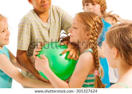 Group of kids fighting over the ball