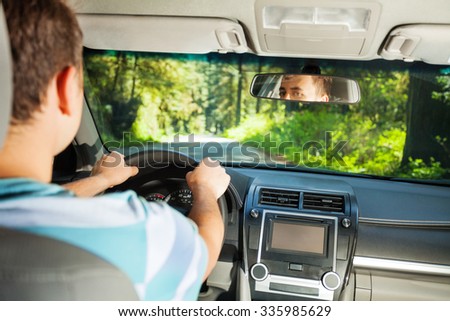 Image, Stock Photo Man driving from behind