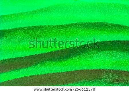 Green lighting on wave cement background. \
Abstract cement background.