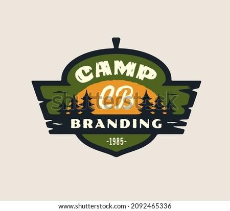 Camping logo emblem concept. Fir spruce tree sun icon Great outdoors symbol. Forest camp lover icon sign. Wild woods adventure design. Acorn shape badge Wooden elements